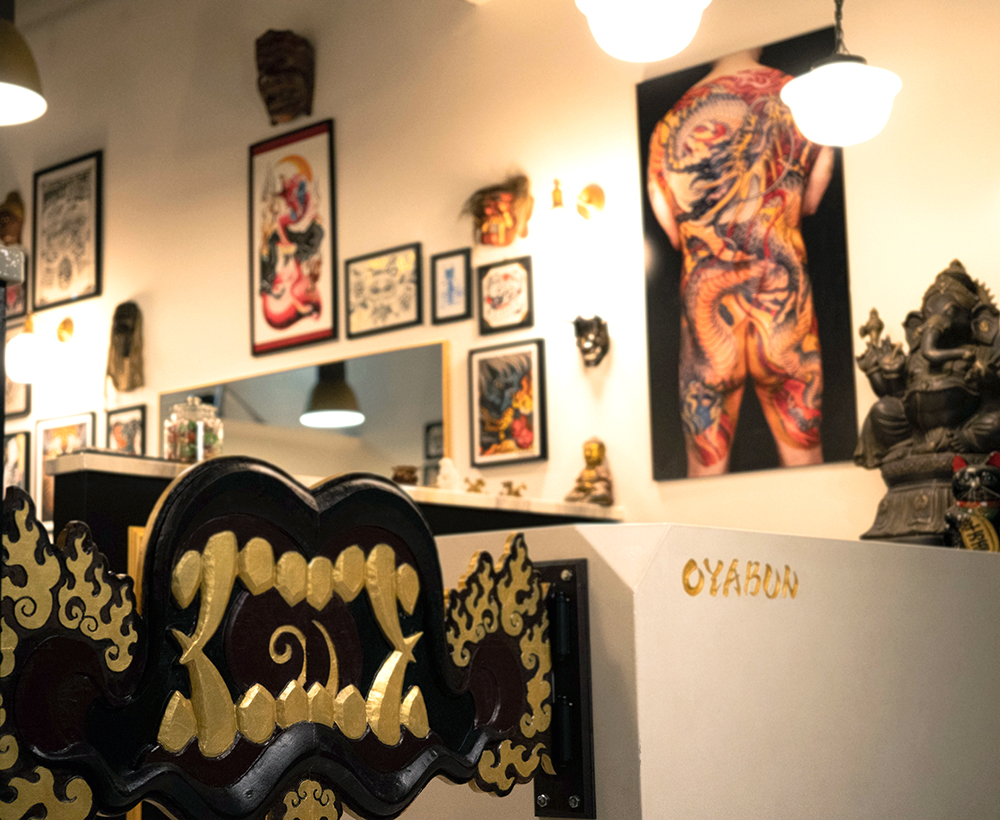 Inside Oyabun Tattoo — ornate front desk with gold details